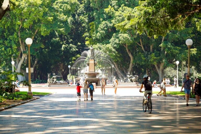 People strolling near the Archibald Fountain in Hyde Park, Sydney.