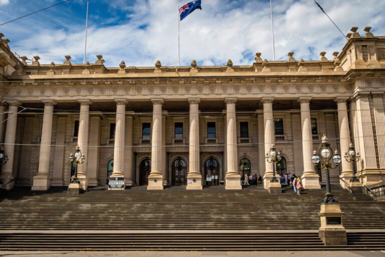 Front view of Parliament House in Melbourne with columns and steps