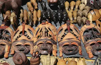 Traditional African masks and carvings at a South African craft market