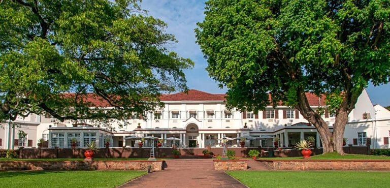 Colonial-style Victoria Falls hotel with lush gardens