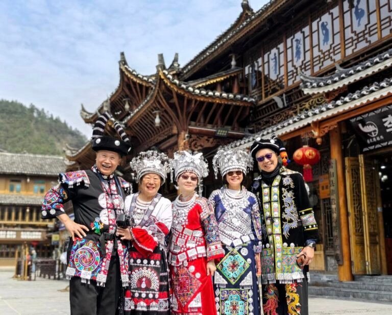 Tourists wearing traditional Miao costumes Yunnan Guizhou China tour GoGo Tours