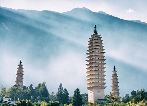 Three Pagodas at Chongsheng Temple with mountain backdrop