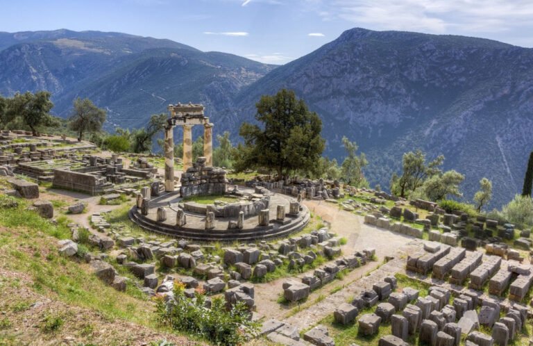 Ruins of the Temple of Apollo at Delphi with mountains in the background