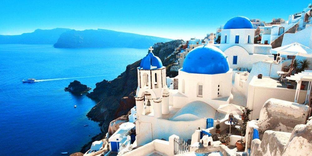 Oia village white buildings blue domes Santorini Greece GoGo Tours