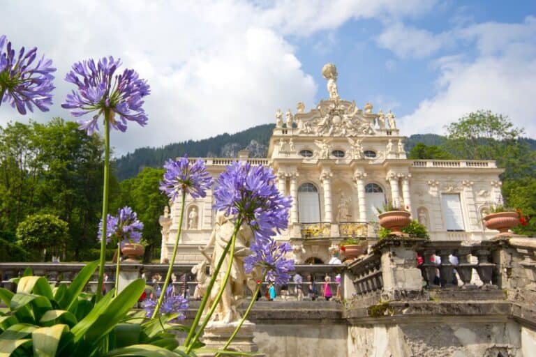 Linderhof Palace with blooming flowers in the foreground
