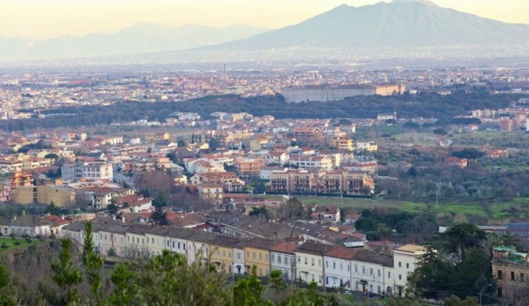 Aerial view of Caserta with Mount Vesuvius in the background.