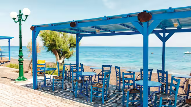 Kamari Beach Santorini Greece black sand turquoise sea GoGo Tours