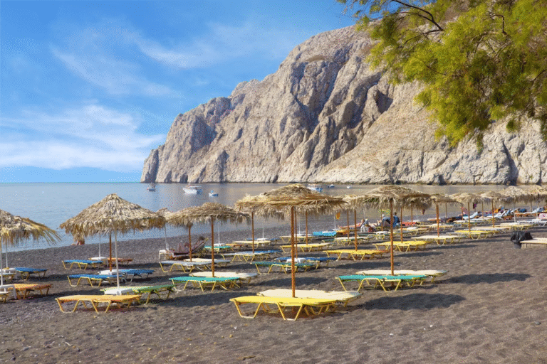 Kamari Beach Santorini Greece tourists sunbathing GoGo Tours