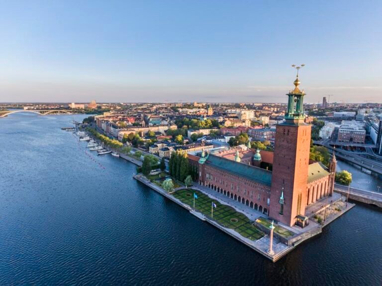 Aerial view of Stockholm City Hall by the water.