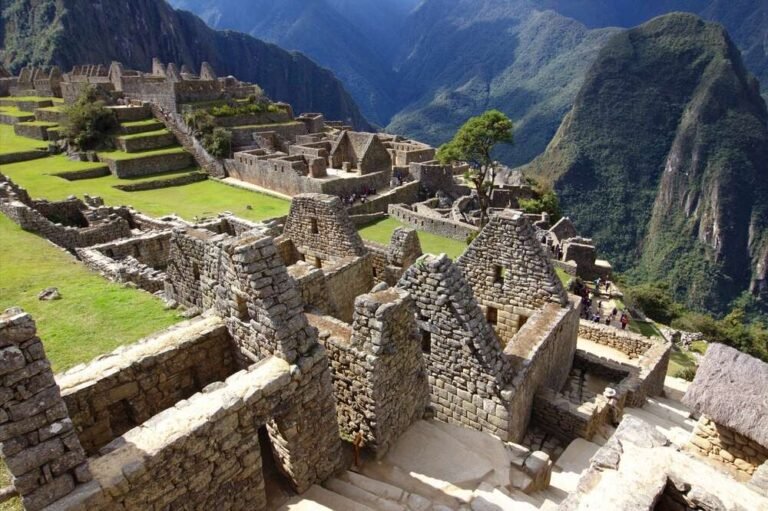 Ancient stone structures of Machu Picchu with mountain backdrop