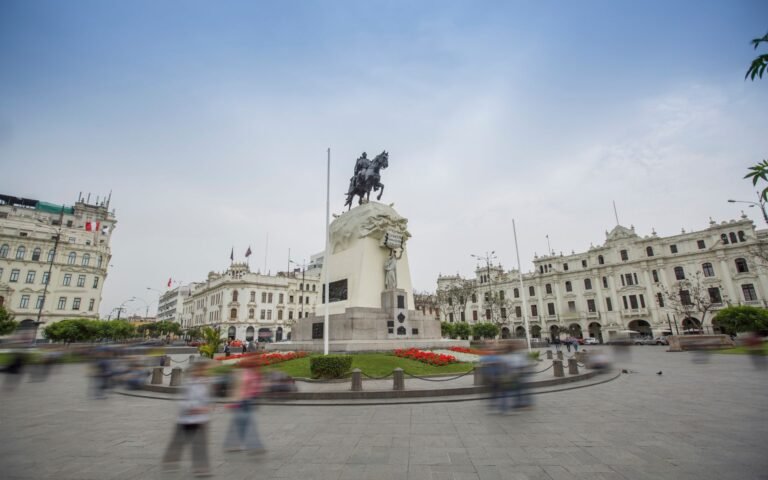 San Martín Square in Lima with monument and colonial architecture.