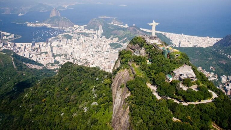 Aerial view of Christ the Redeemer statue overlooking Rio de Janeiro.
