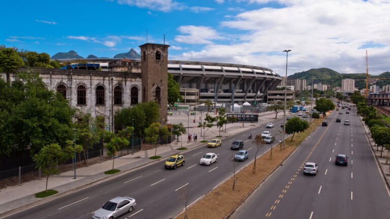 View of Maracanã Stadium in Rio de Janeiro with surrounding road and vehicles.