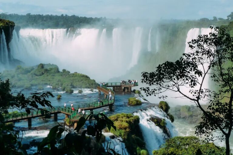 Tourists on a walkway at Iguazu Falls.