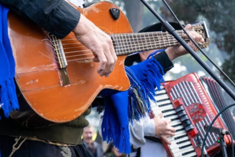 Traditional gaucho music performance with guitar and accordion.