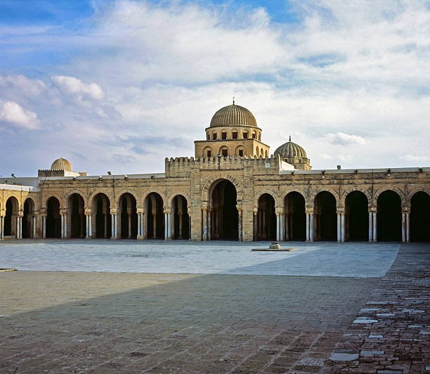 Great Mosque of Kairouan courtyard with arches and domes.
